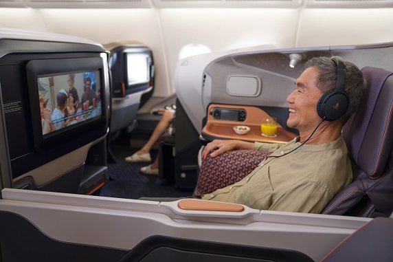 Man enjoying Singapore Airlines Inflight Entertaiment
